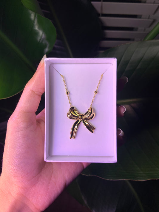 Large gold bow necklace