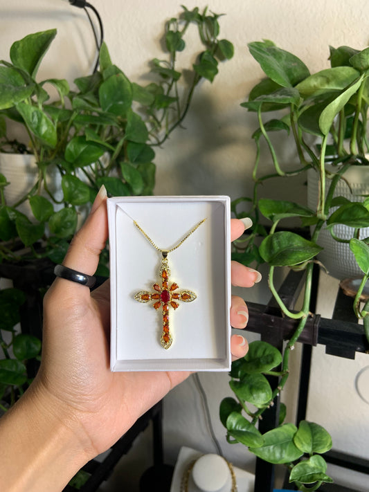 Ruby red golden cross